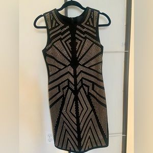 Black dress with gold embellishments.